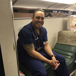 blood drive phlebotomist smiling in uniform