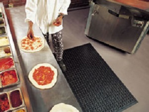 cook making pizza in uniform