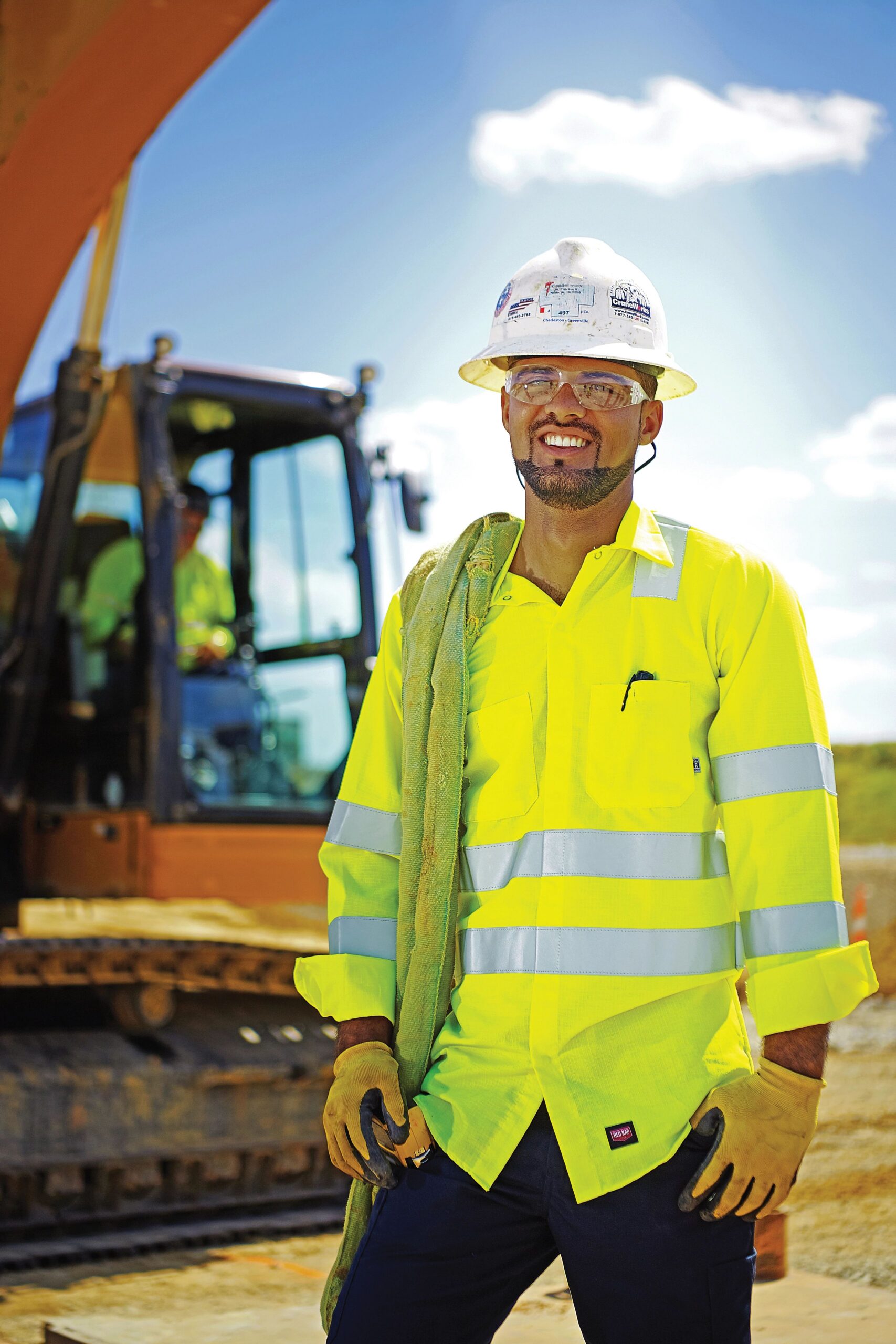 Construction worker wearing a high-visibility safety work shirt on construction job site